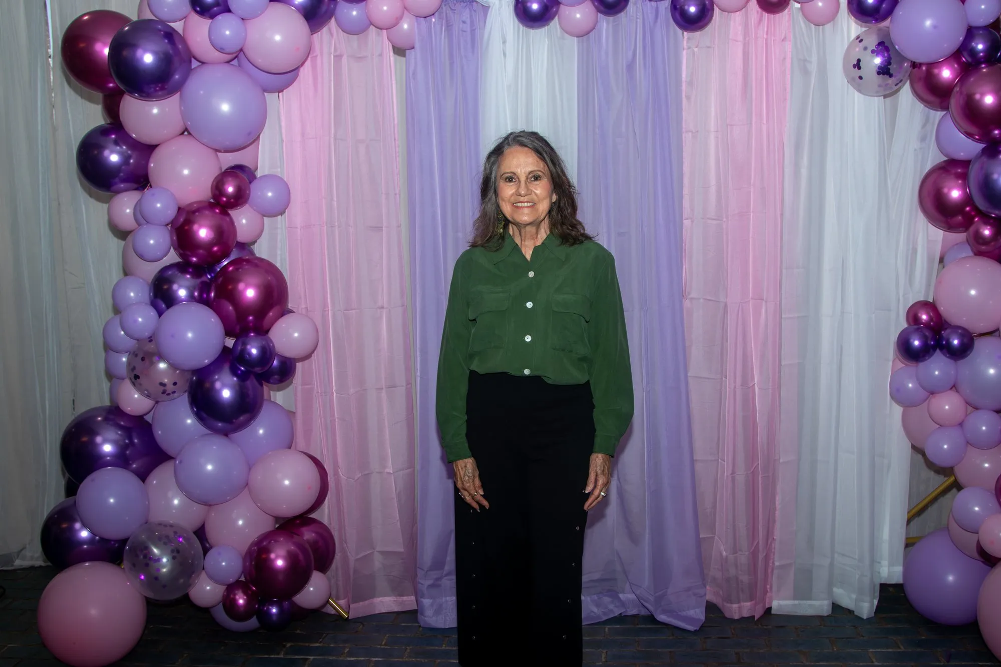 A woman at the entrance backdrop before the day begins