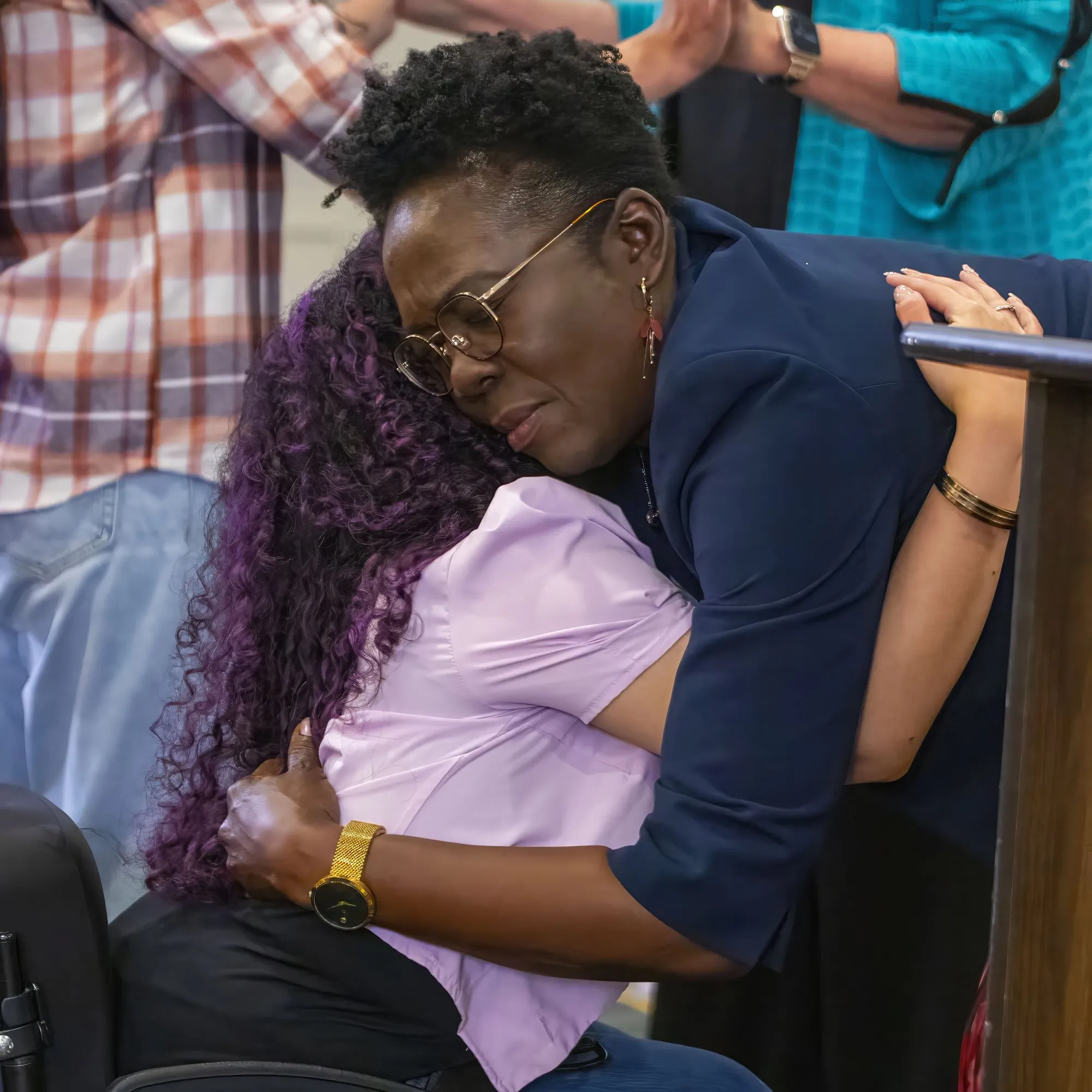 Two women embracing during ministry time