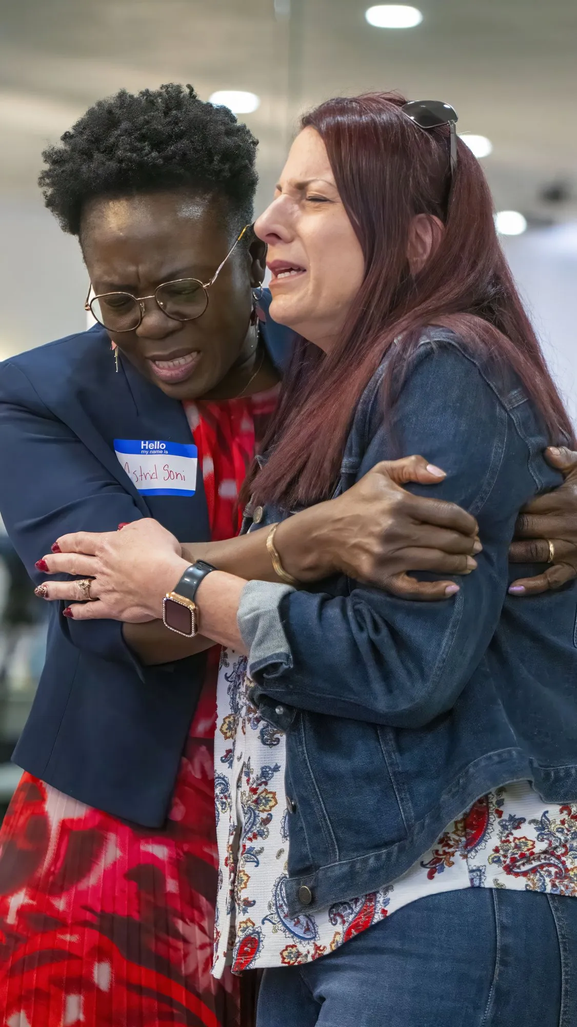 Two women holding each other closely