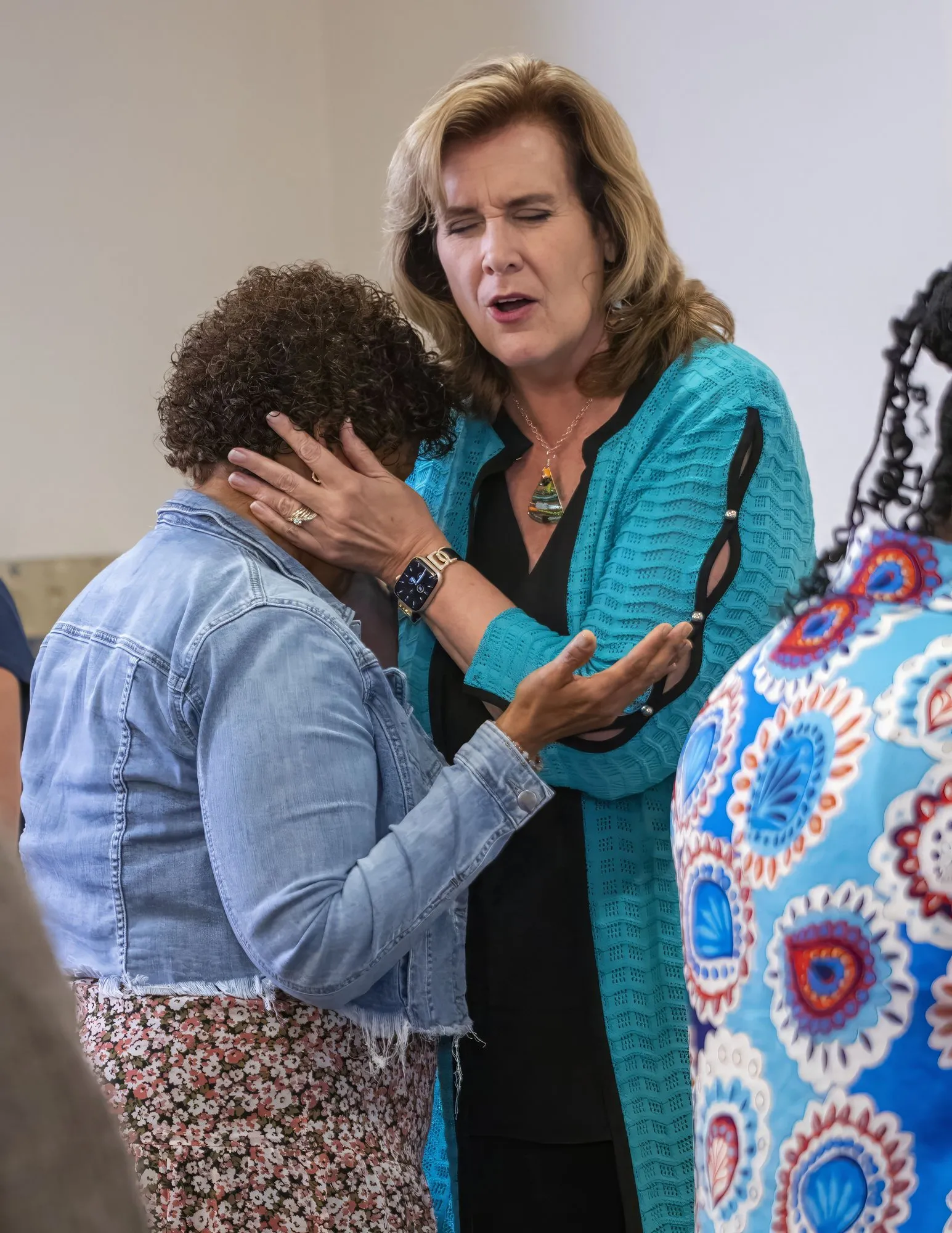 Two women praying together