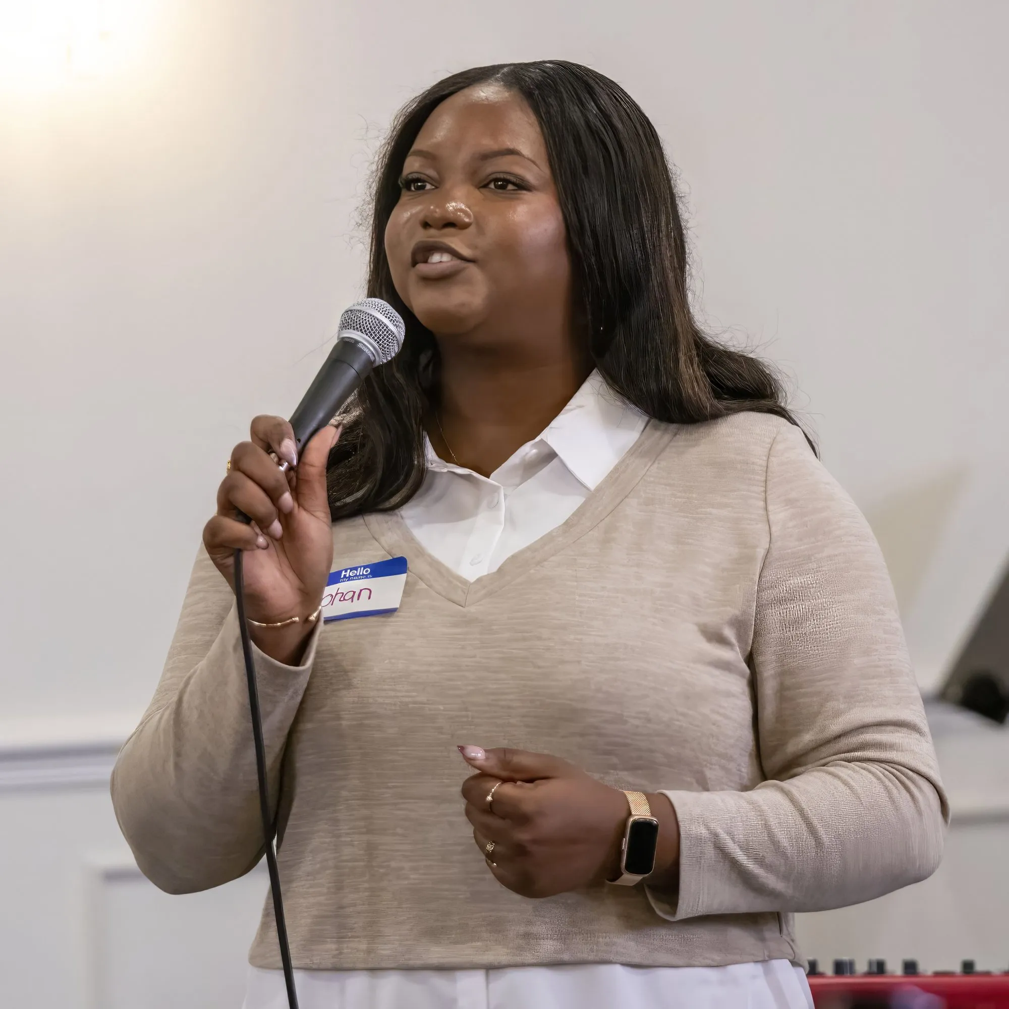 A woman speaking to the room