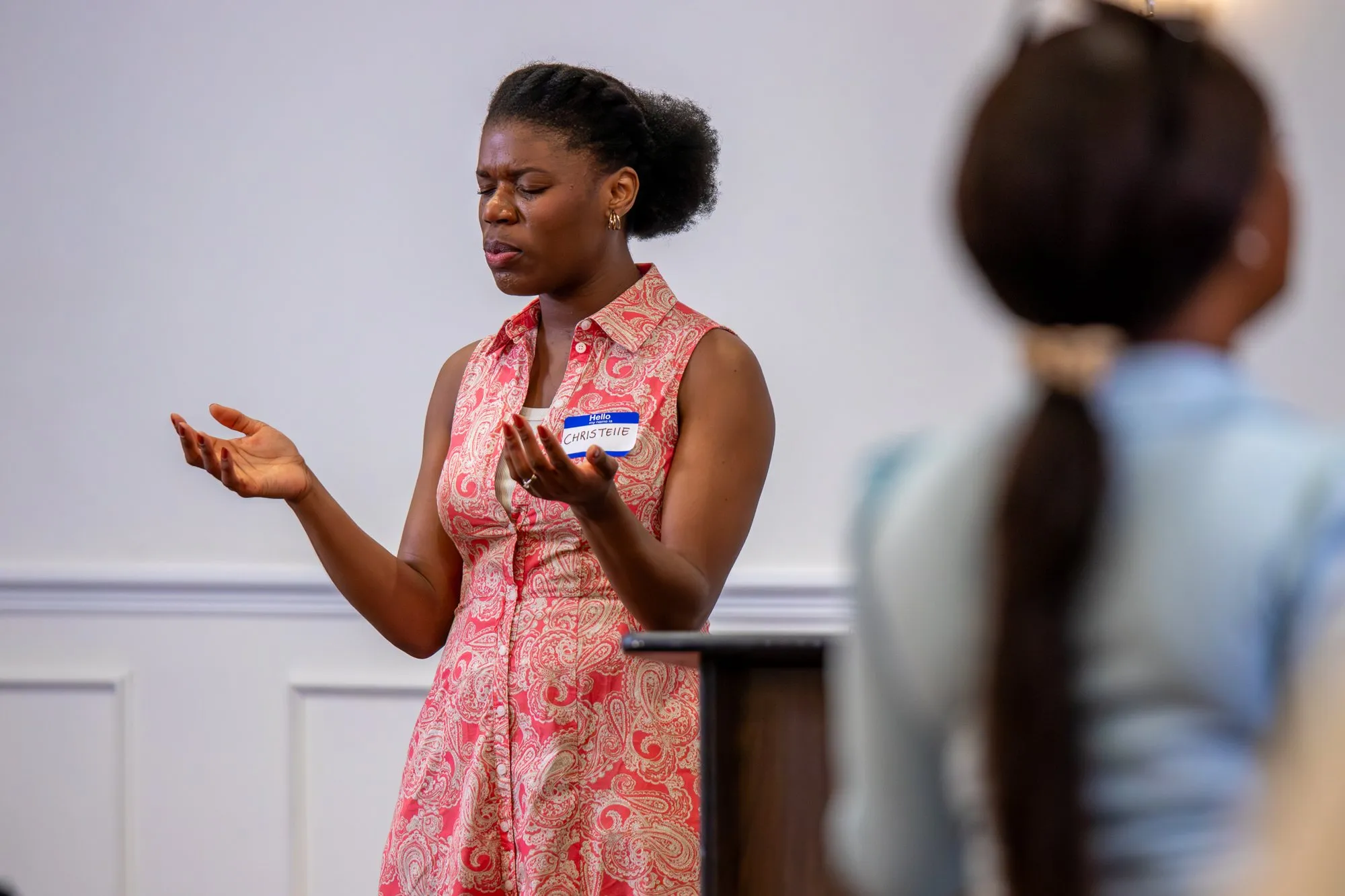 A young woman singing in worship