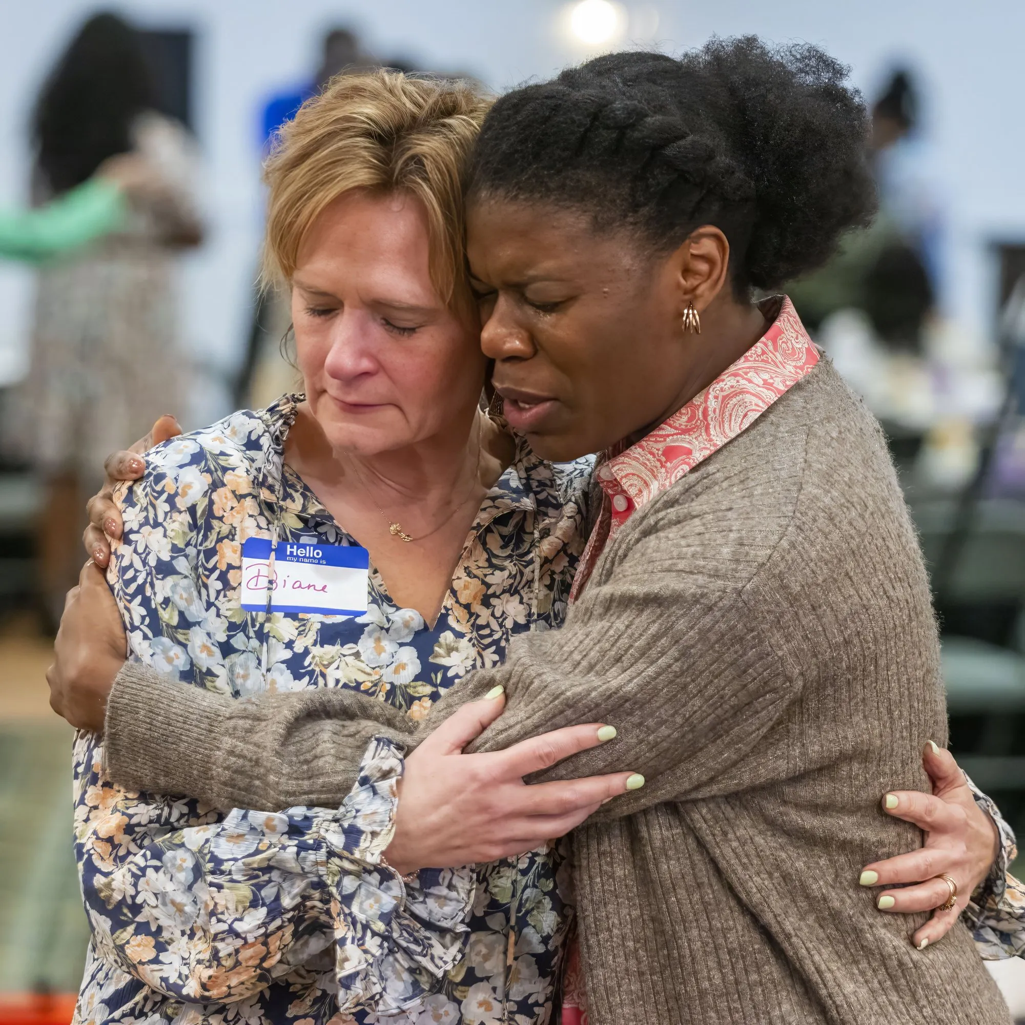 Two women holding each other